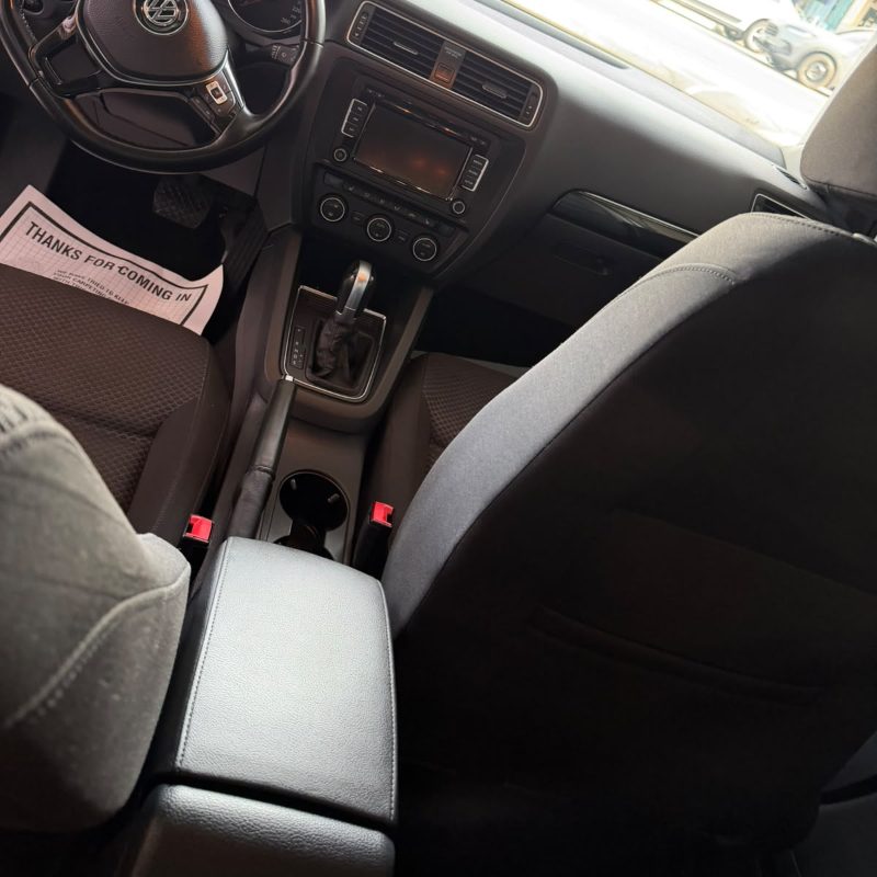 Car interior with dash, console and seats wiped down at Splash N Shine